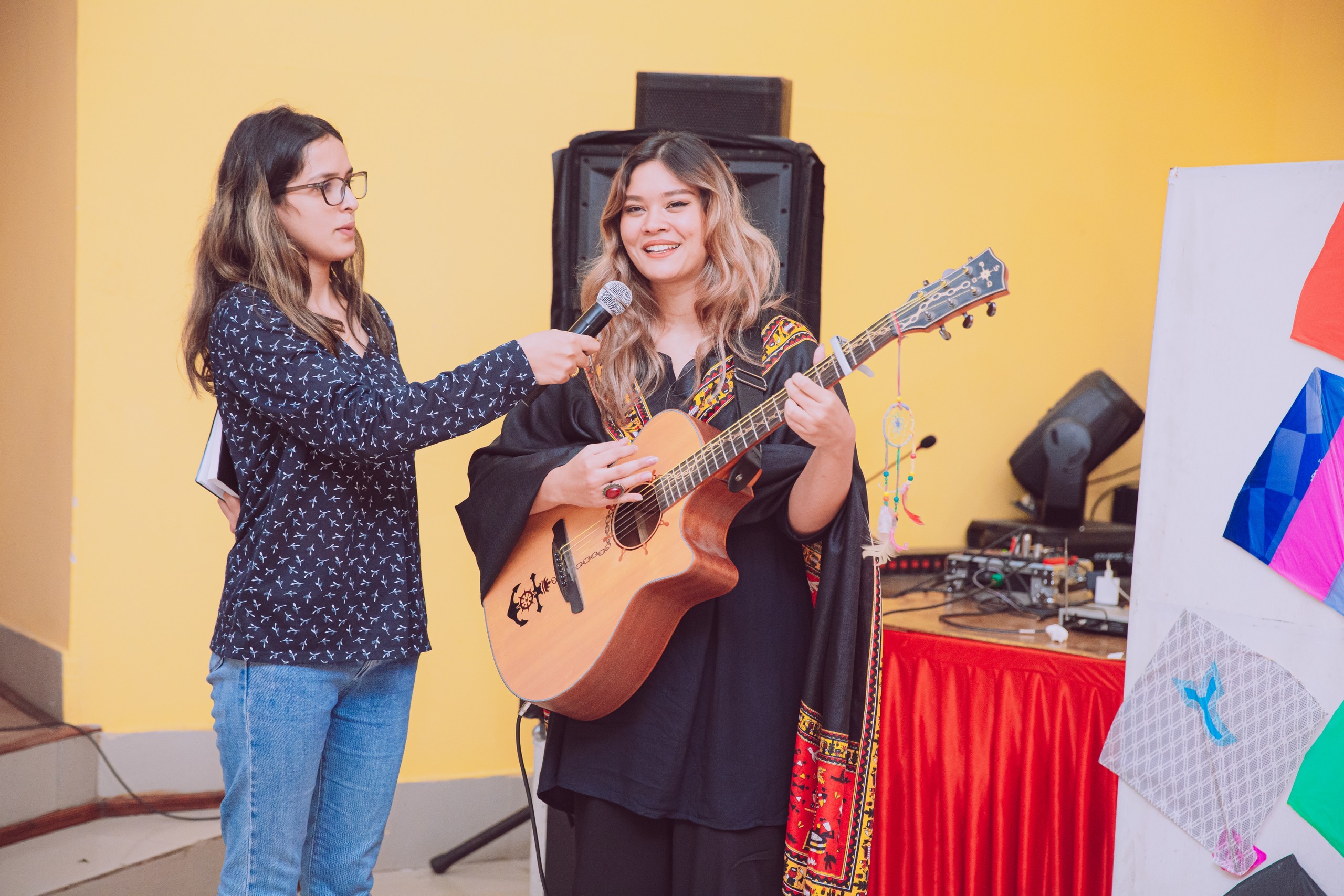 one holding mic and another singing